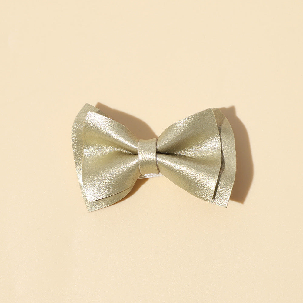 Handmade cloth bow tie hair clips for girls in various colors including white, purple, yellow, khaki, gold, and brown.