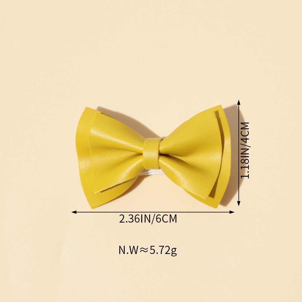 Handmade cloth bow tie hair clips for girls in various colors including white, purple, yellow, khaki, gold, and brown.