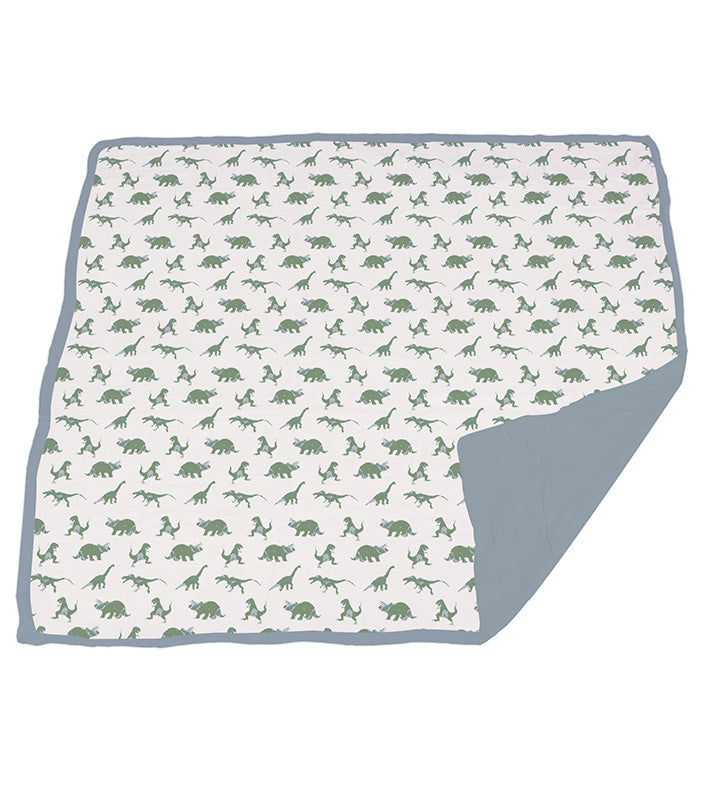 Granite Green Dinosaurs and Blue Fog Cotton Newcastle Blanket, featuring a playful dinosaur design on soft cotton fabric.