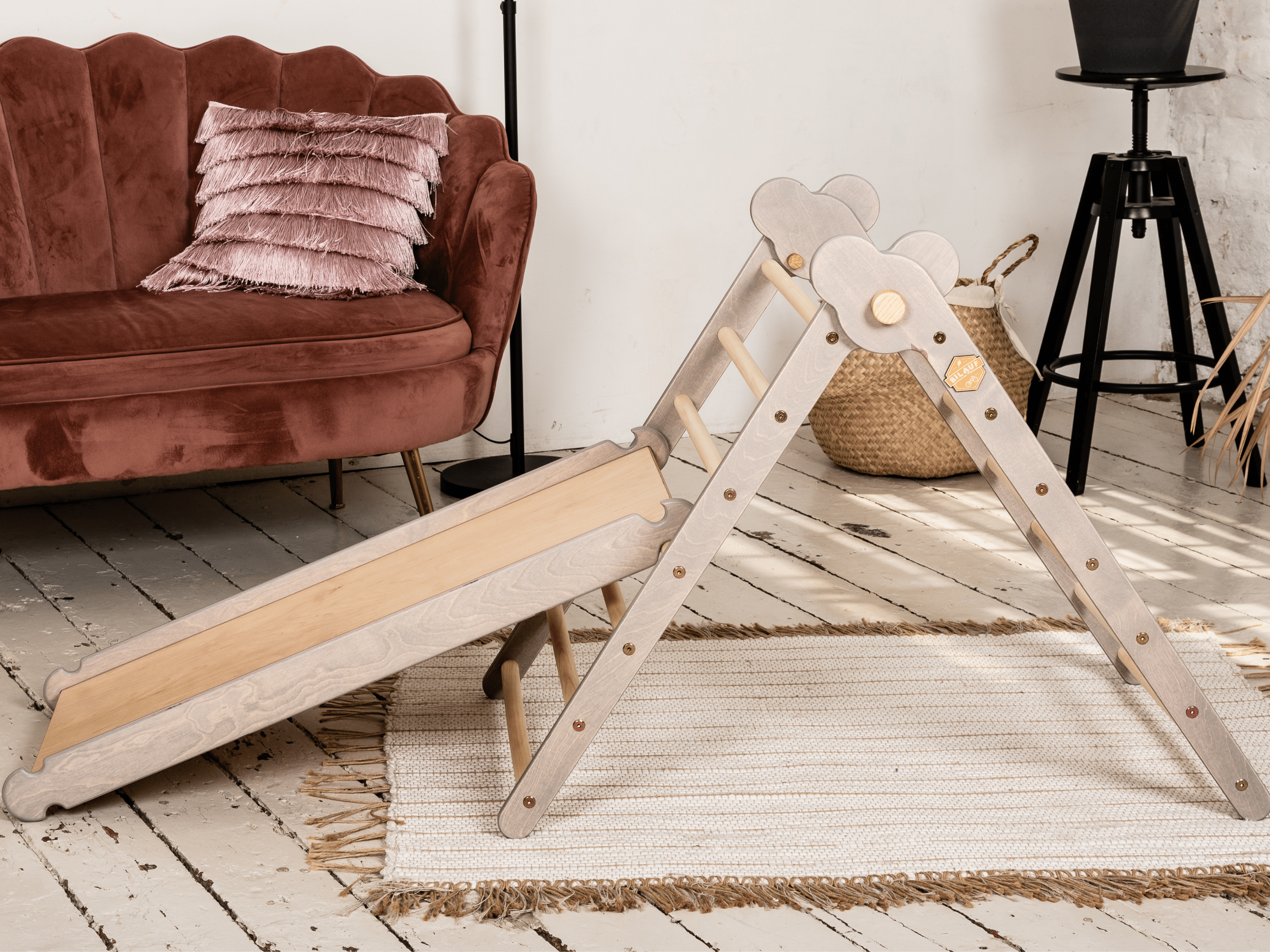 Gray Teddy Rock climbing set featuring a climbing triangle, ramp, and balance board made from natural wood, designed for children.