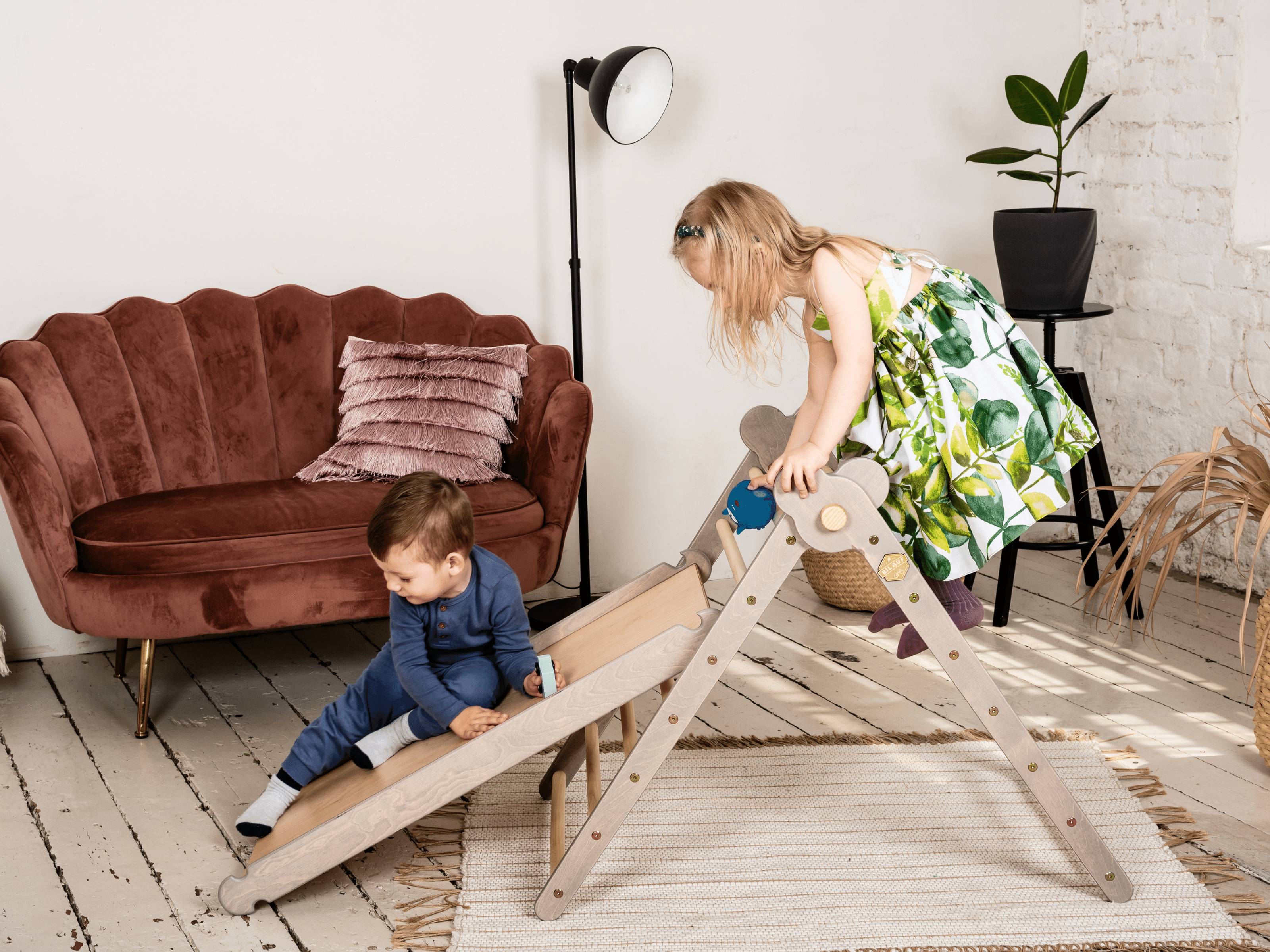 Gray Teddy Rock climbing set featuring a climbing triangle, ramp, and balance board made from natural wood, designed for children.