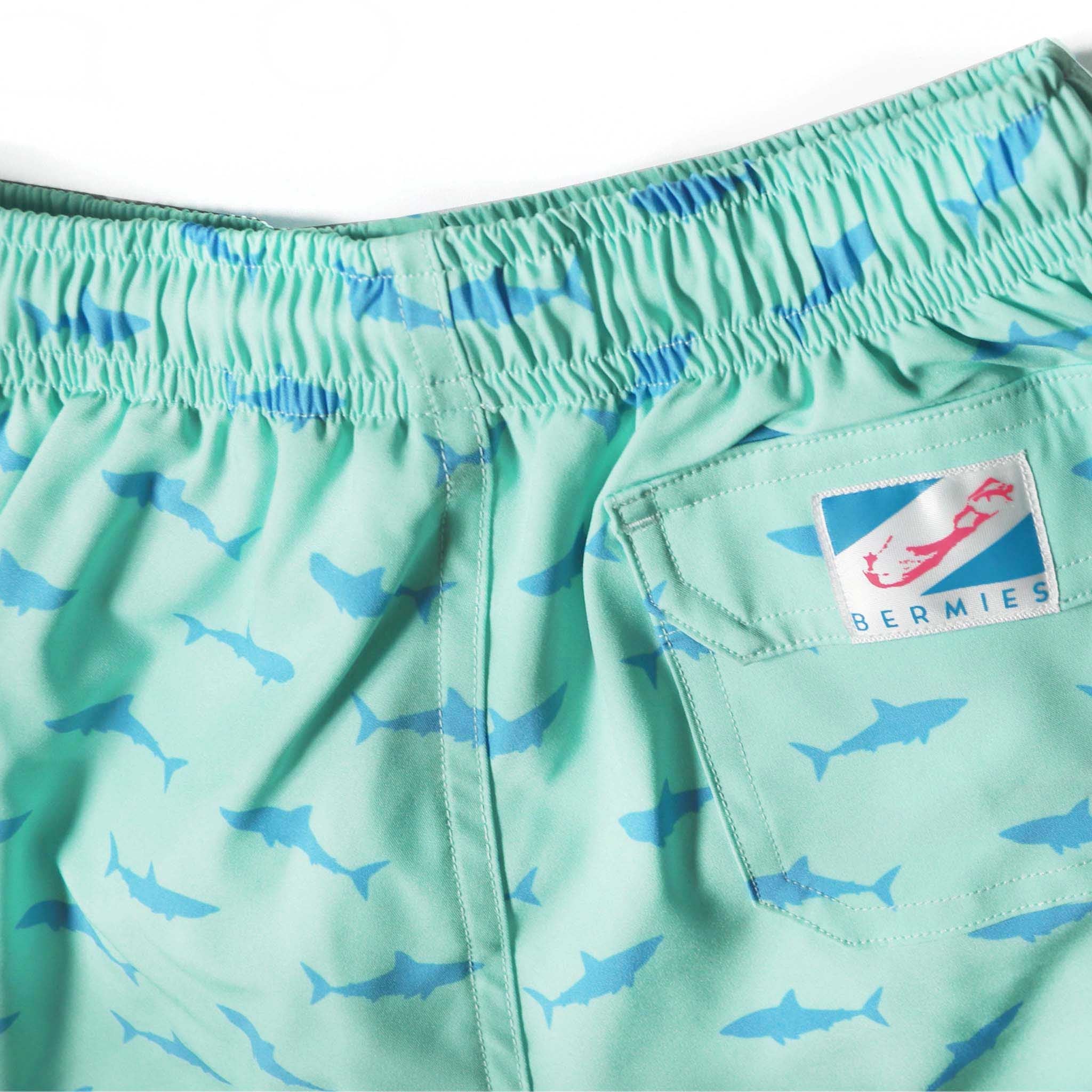 Great White Kids Swim Trunks made from recycled materials, featuring a 4-way stretch mesh liner and multiple pockets.