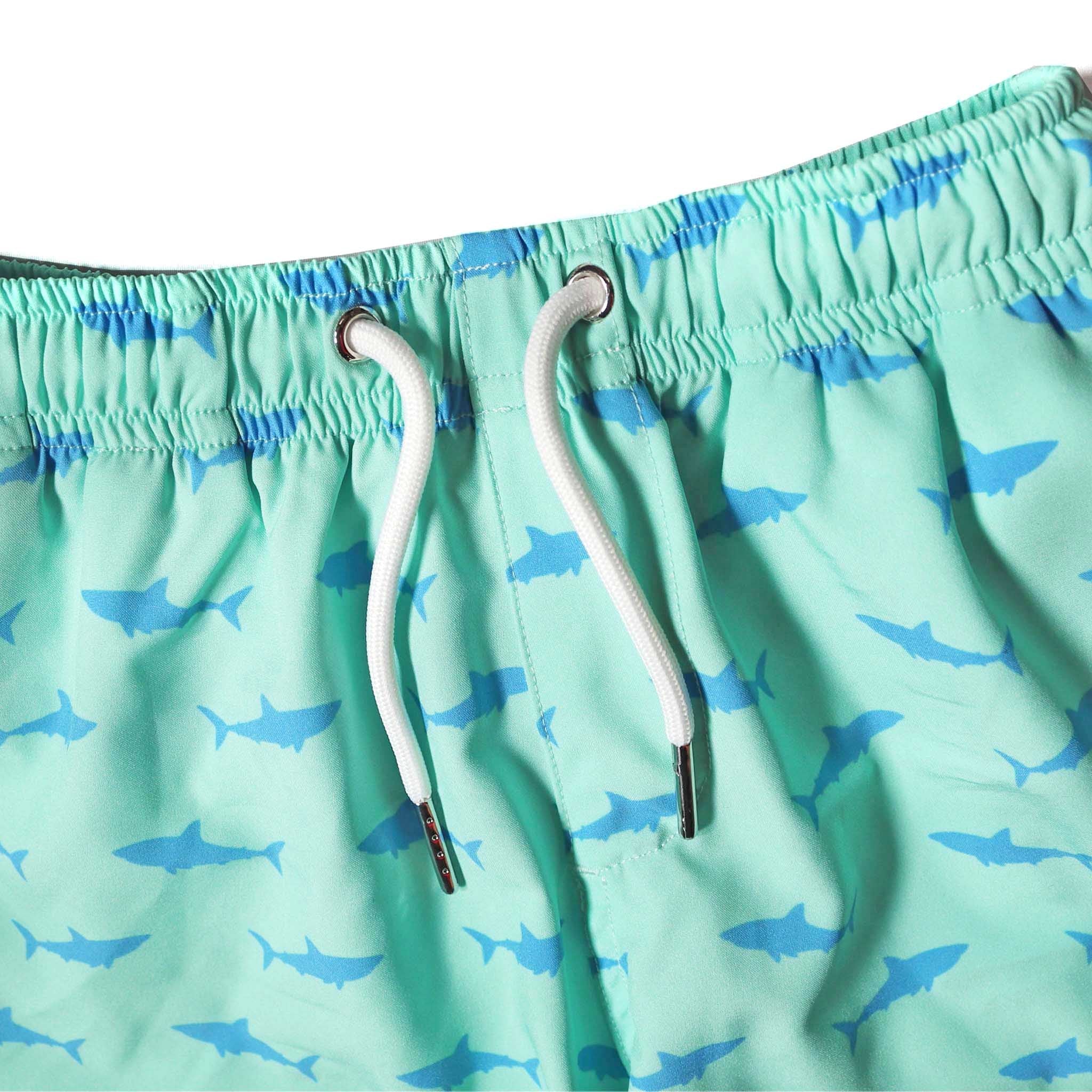 Great White Kids Swim Trunks made from recycled materials, featuring a 4-way stretch mesh liner and multiple pockets.