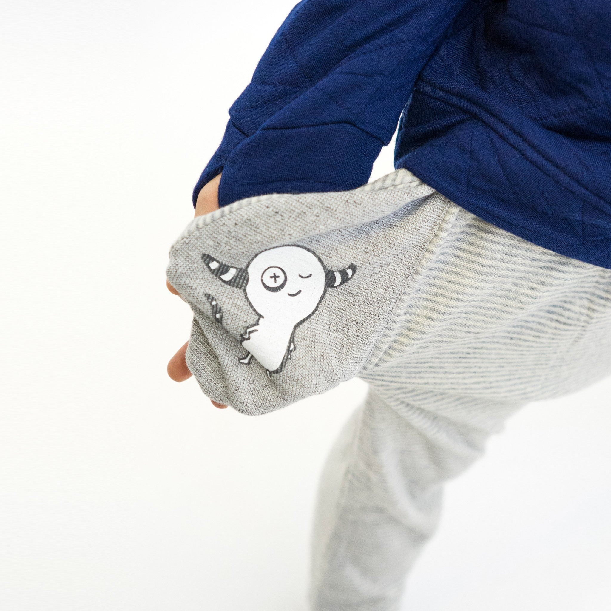 Youth Hammer Pants in grey with skinny stripes, featuring a hidden monster pocket and drop crotch harem style, made from soft cotton-spandex blend.