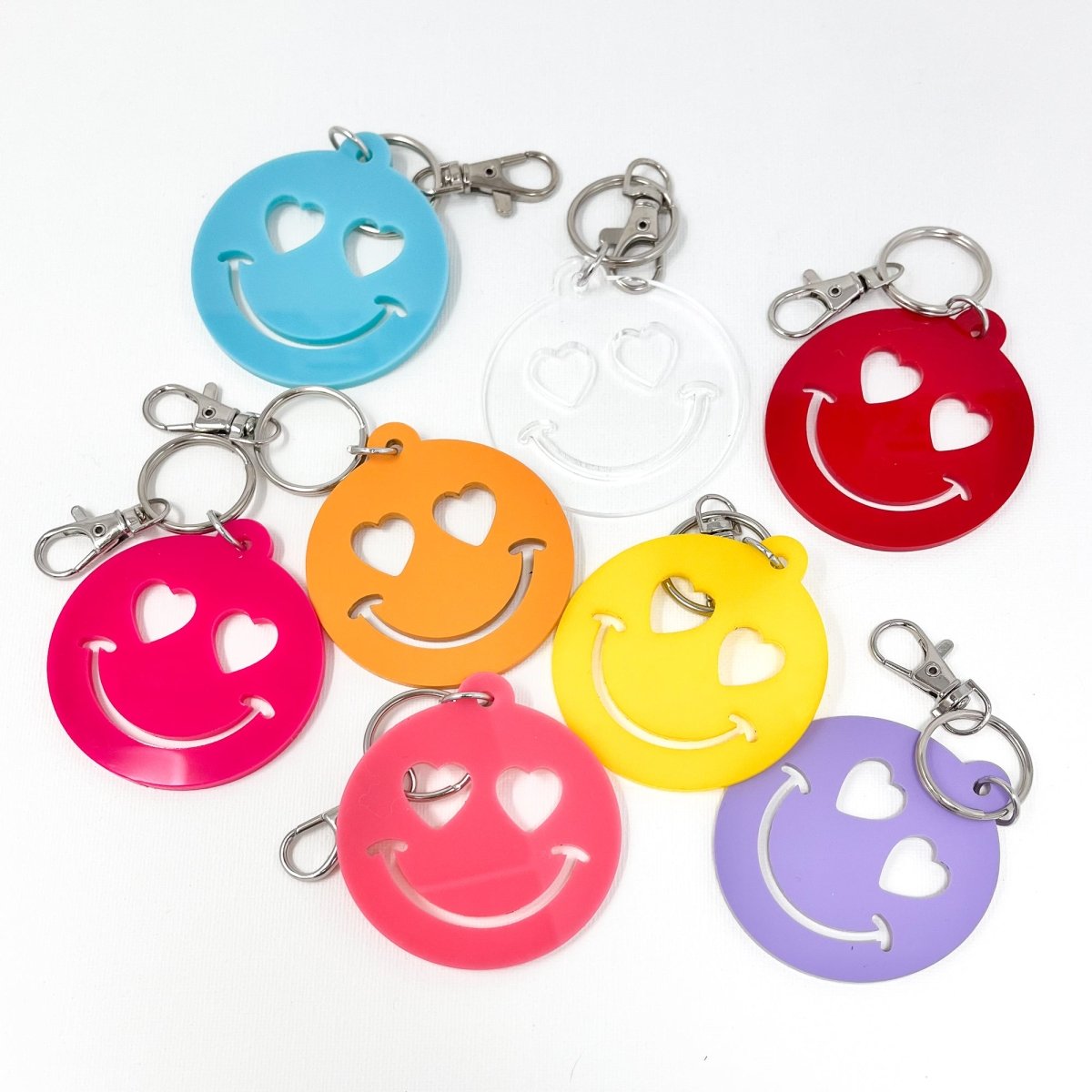 Colorful Heart Smiley Face Keychain made of acrylic, showcasing its cheerful design and vibrant colors.