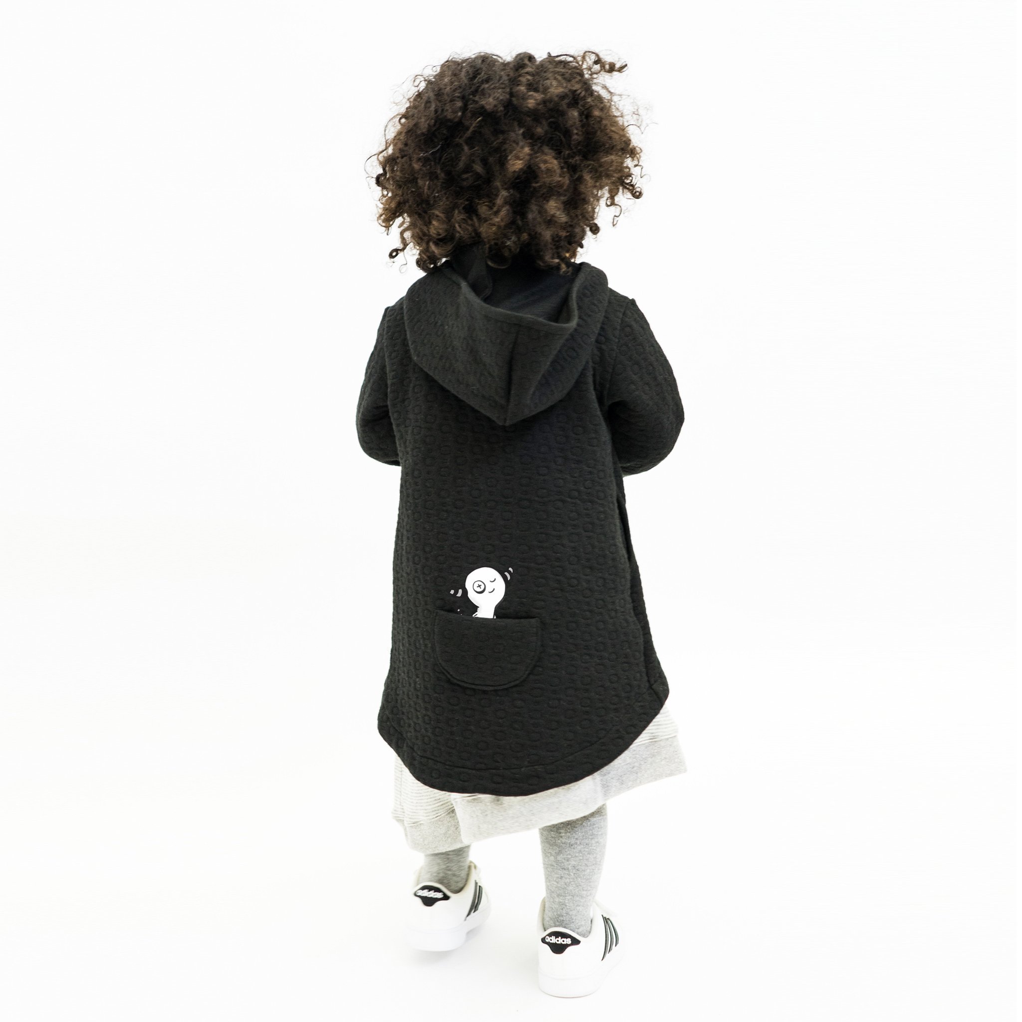 Hi-Lo Quilted Hoodie featuring a playful design with a monster peek-a-boo pocket and circle quilted pattern.