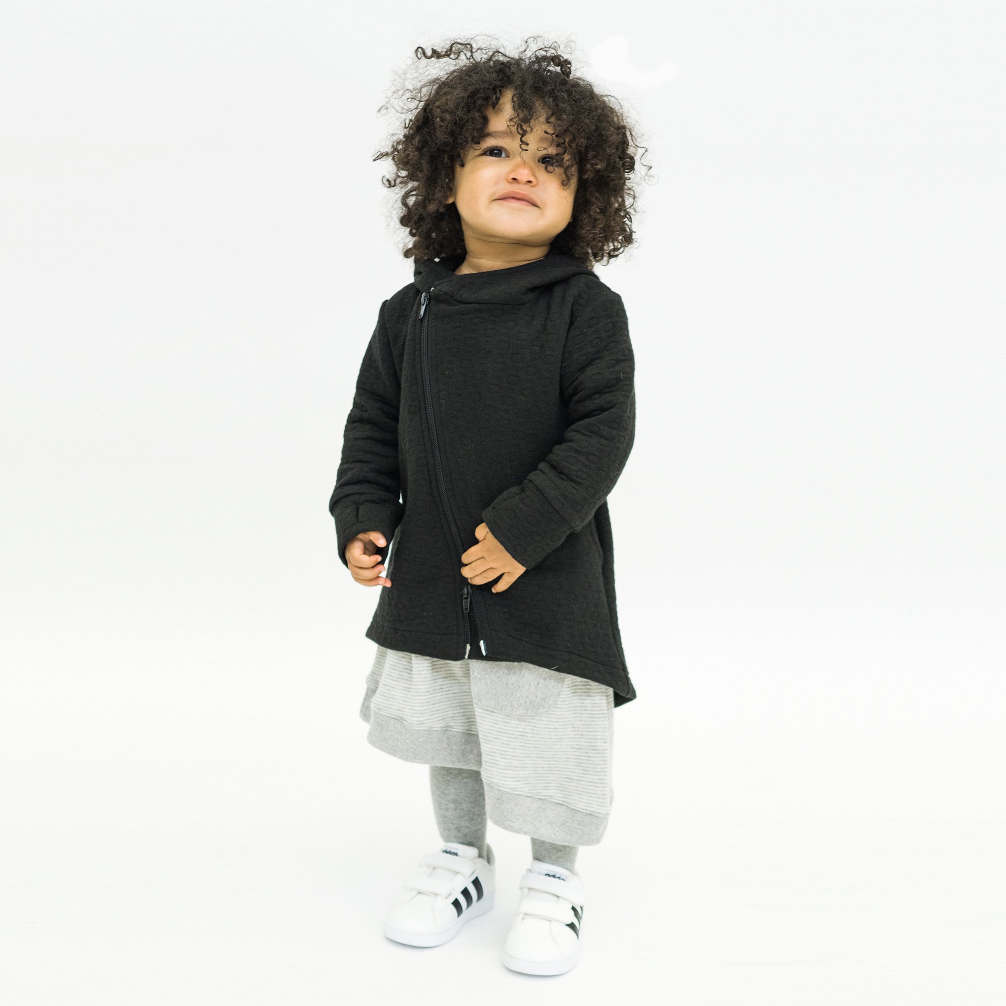 Hi-Lo Quilted Hoodie featuring a playful design with a monster peek-a-boo pocket and circle quilted pattern.