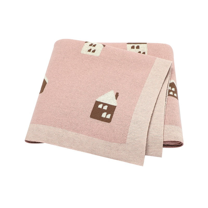 A soft knitted cute little house in vibrant colors, showcasing its cartoon pattern and cotton material, perfect for kids and adults.