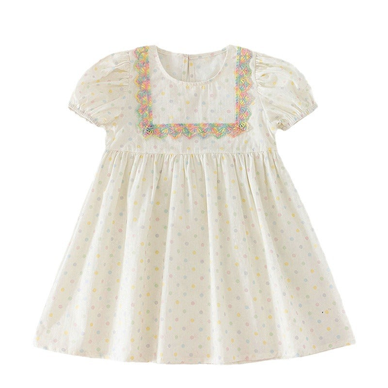 A beige summer dress for girls featuring short sleeves and a playful polka dot pattern, perfect for warm weather outings.