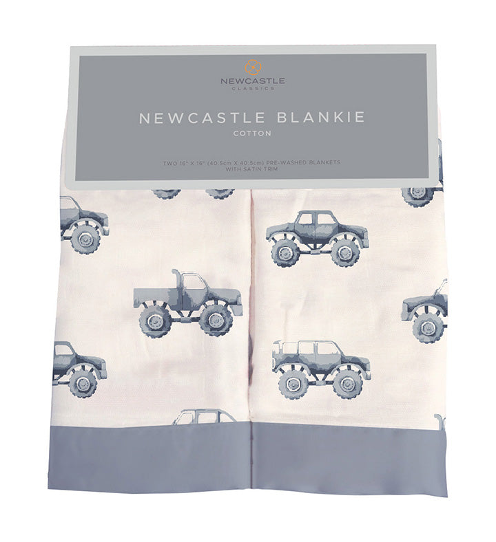 Indigo Monster Trucks Cotton Newcastle Blankie featuring vibrant truck designs on soft cotton muslin fabric, perfect for children.