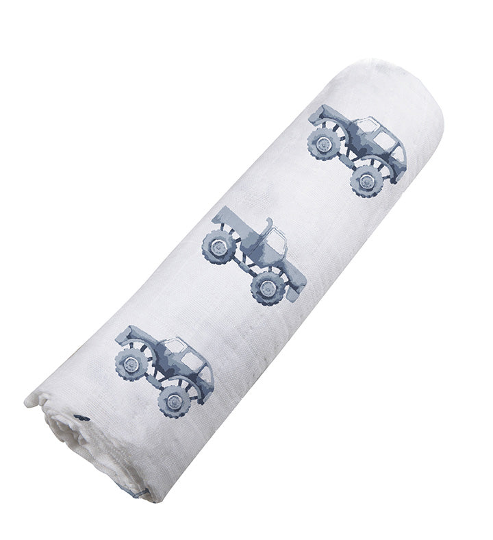 Indigo Monster Trucks Cotton Swaddle featuring playful truck designs on soft muslin fabric, perfect for swaddling and versatile baby care.