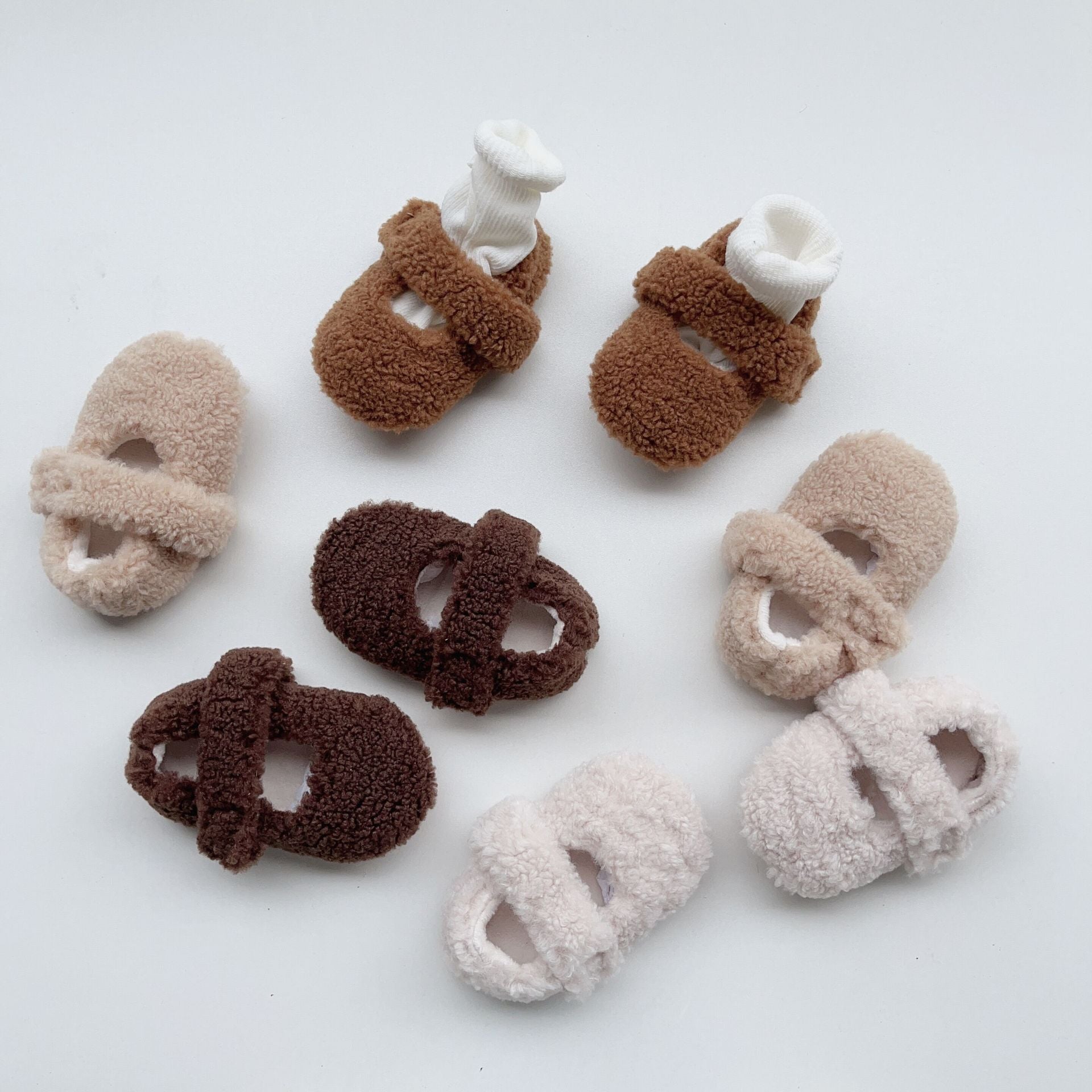 Infant baby solid color plush warm shoes in white, apricot, brown, and coffee, perfect for winter wear.