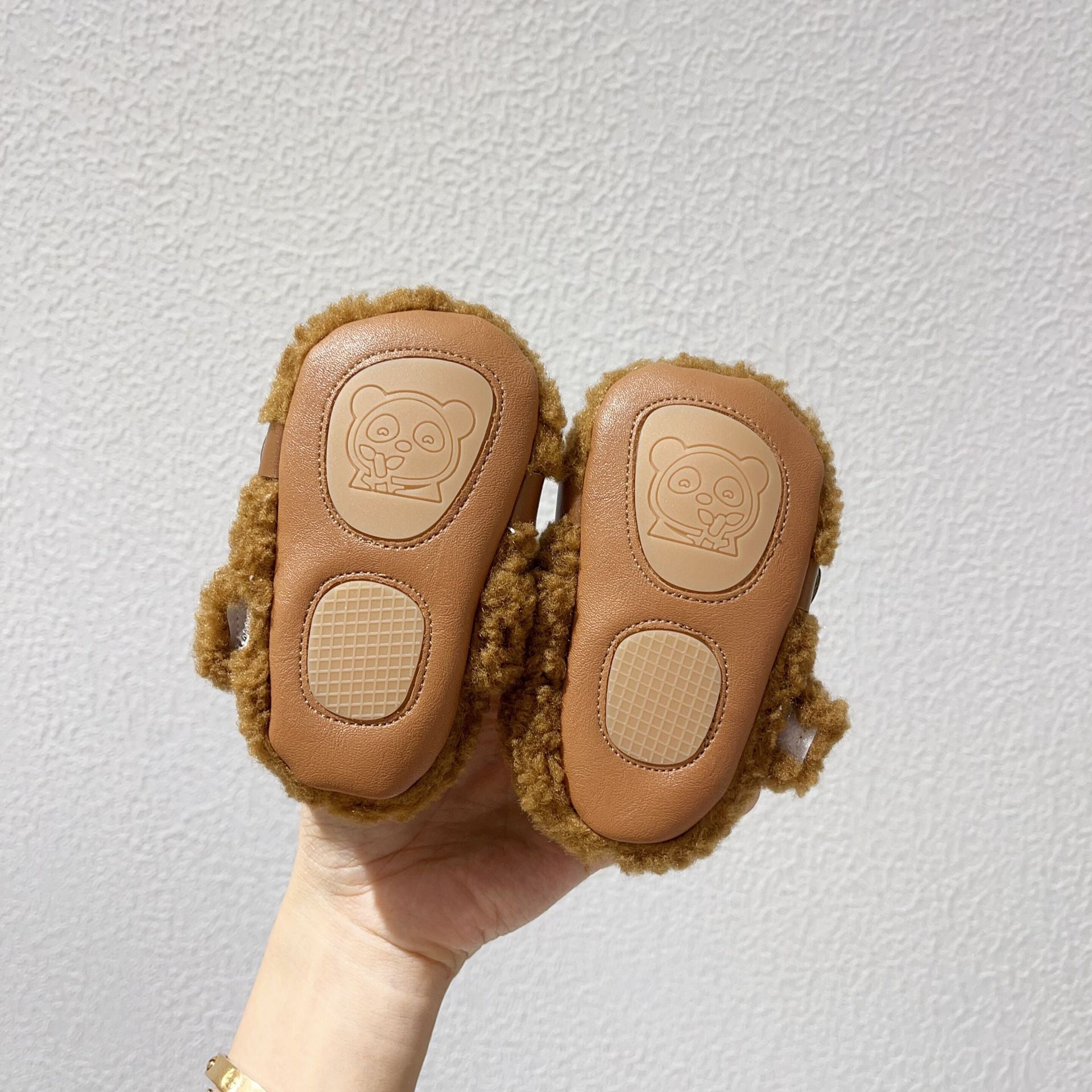 Infant baby solid color plush warm shoes in white, apricot, brown, and coffee, perfect for winter wear.