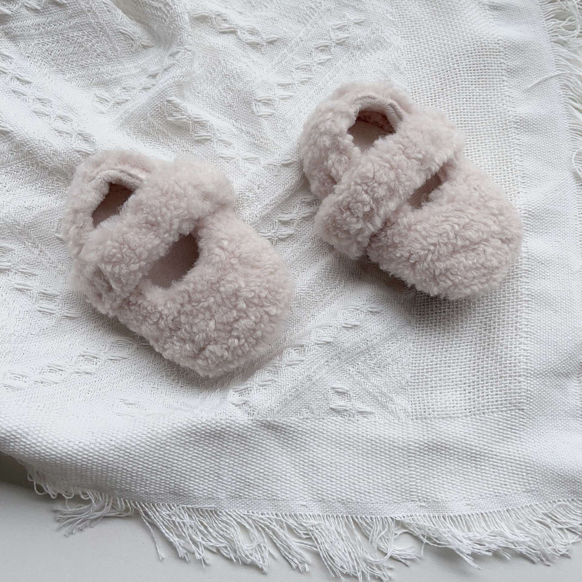 Infant baby solid color plush warm shoes in white, apricot, brown, and coffee, perfect for winter wear.