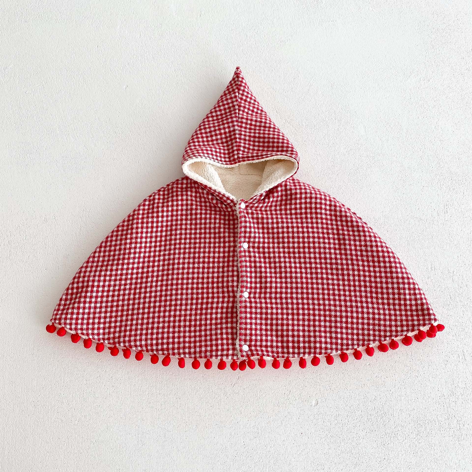 A cozy thick warm cloak for baby girls in red and apricot colors, featuring plaid and heart patterns, perfect for winter wear.