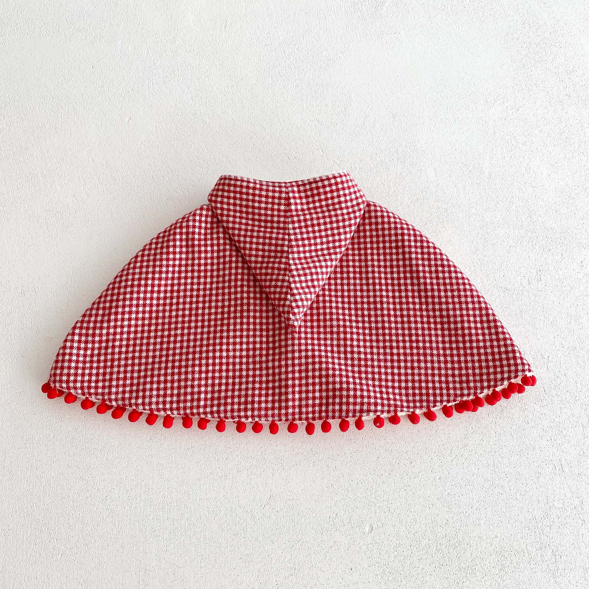 A cozy thick warm cloak for baby girls in red and apricot colors, featuring plaid and heart patterns, perfect for winter wear.