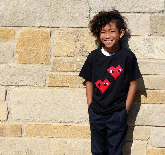 Black Kids T-shirt featuring unique felt appliqué design by Donald Robertson, handmade with love in Paradise.