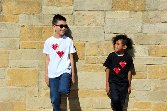 Black Kids T-shirt featuring unique felt appliqué design by Donald Robertson, handmade with love in Paradise.