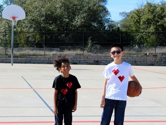 Black Kids T-shirt featuring unique felt appliqué design by Donald Robertson, handmade with love in Paradise.