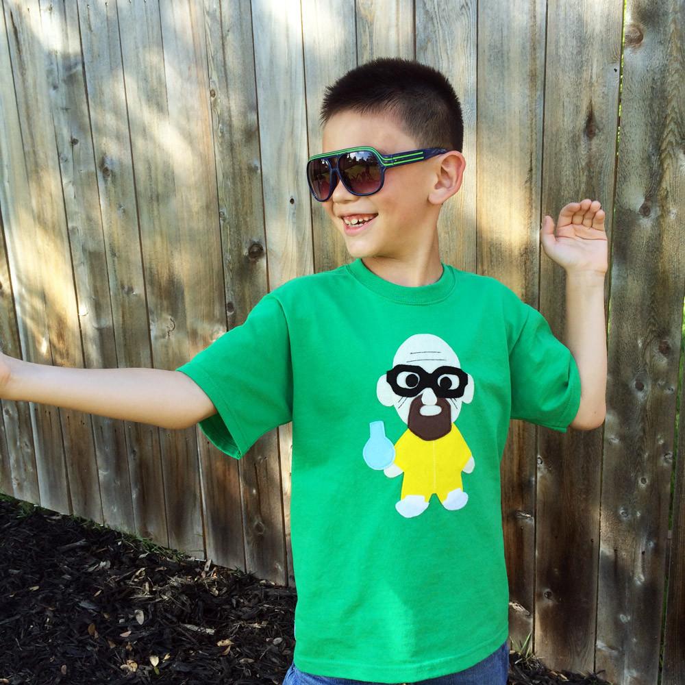 A vibrant green Kids T-shirt featuring a playful cooking design, perfect for little chefs.