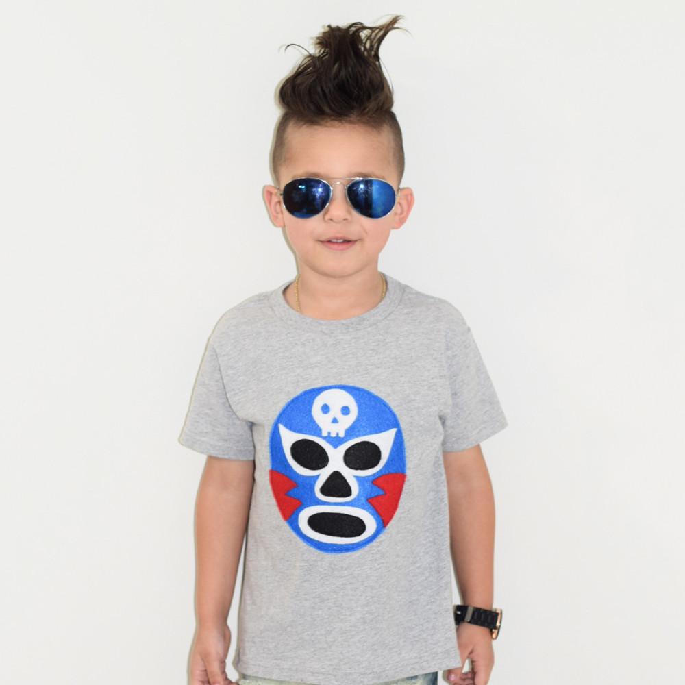 Vibrant Luchador Azul Kids T-shirt featuring colorful appliqué design, perfect for adventures.