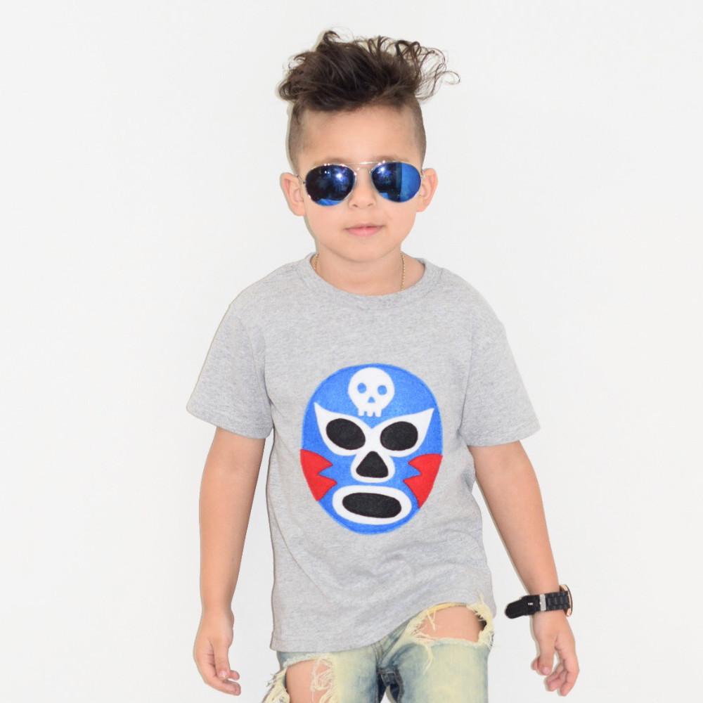 Vibrant Luchador Azul Kids T-shirt featuring colorful appliqué design, perfect for adventures.