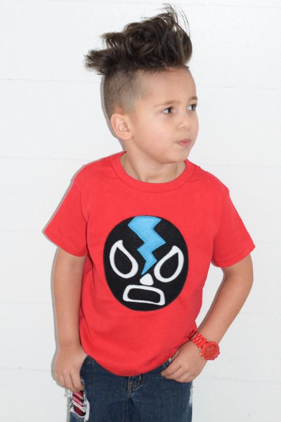 Kids T-shirt featuring a black Mexican wrestler design, perfect for young wrestling fans.