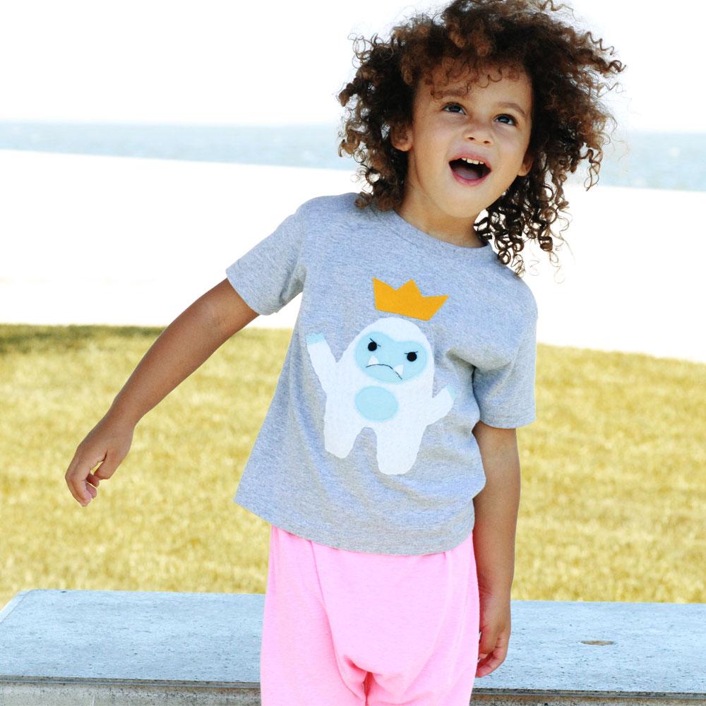 A cute kids t-shirt featuring a Yeti King with a crown, handmade and colorful, perfect for children.