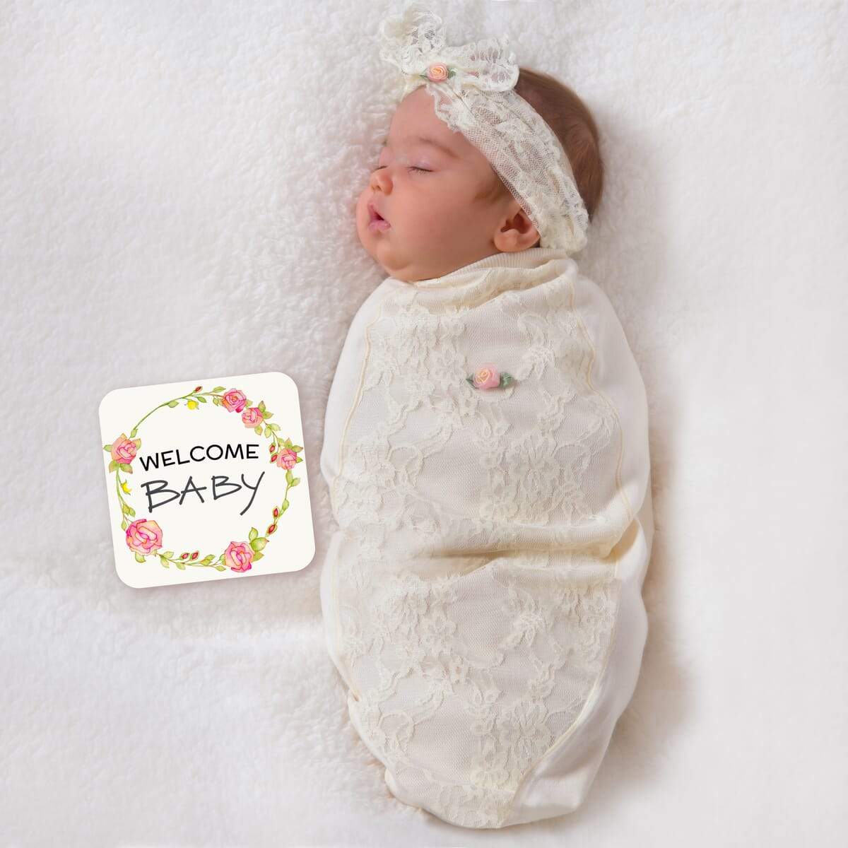 Lace Blossoms baby cocoon swaddle set with matching headpiece and announcement card, designed for newborn comfort.