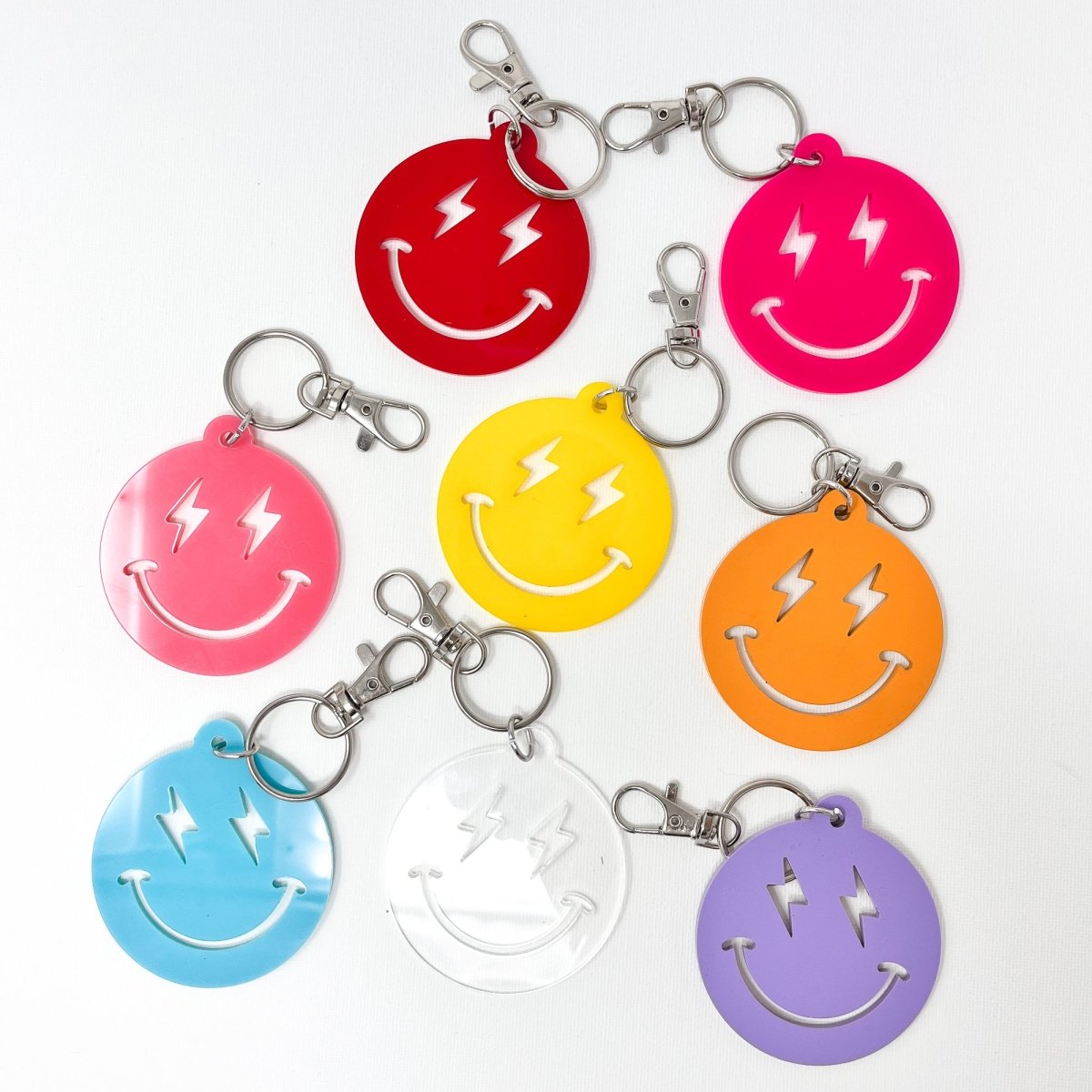 Colorful Lightning Smiley Face Keychain made of acrylic, featuring a cheerful smiley face design, perfect for everyday use.