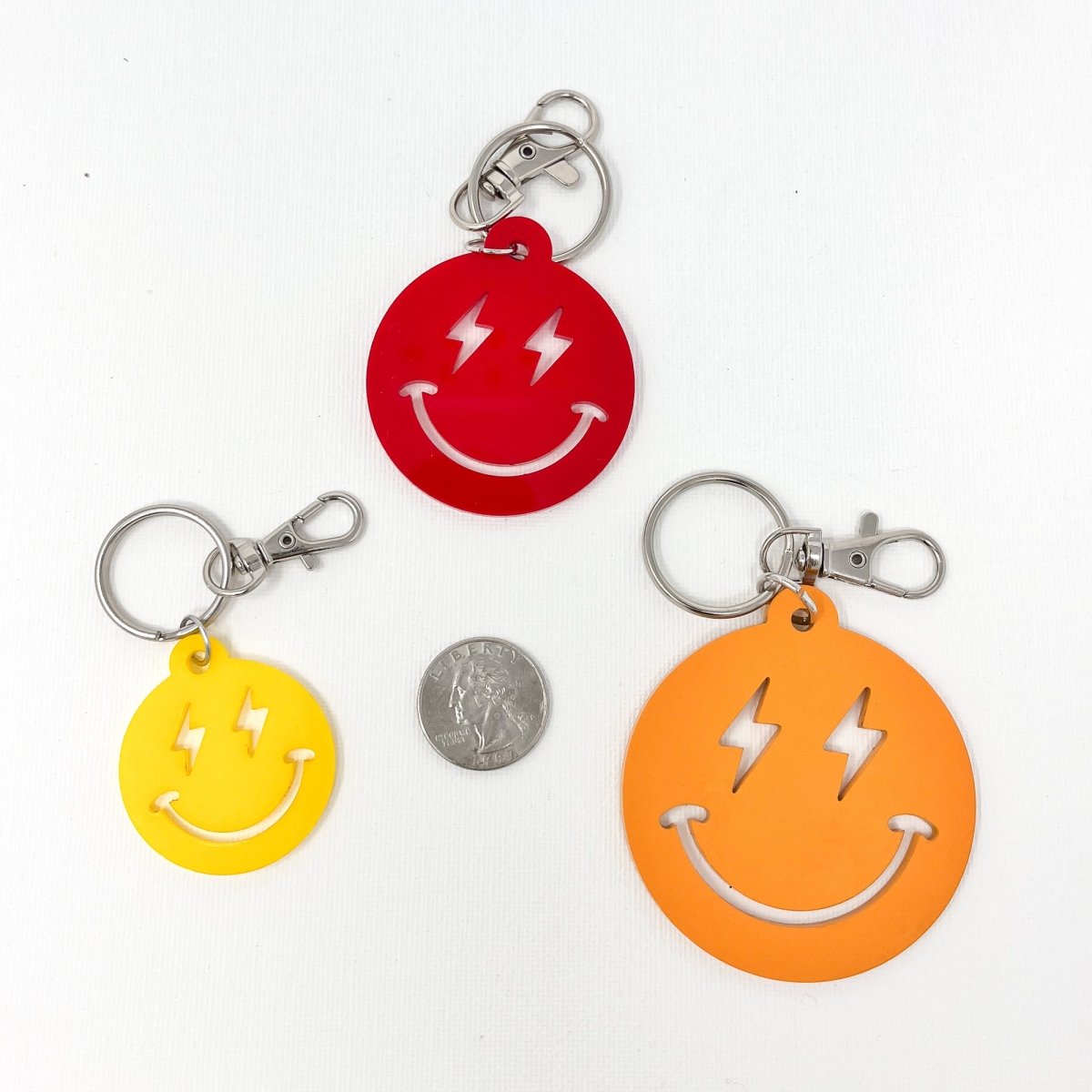 Colorful Lightning Smiley Face Keychain made of acrylic, featuring a cheerful smiley face design, perfect for everyday use.