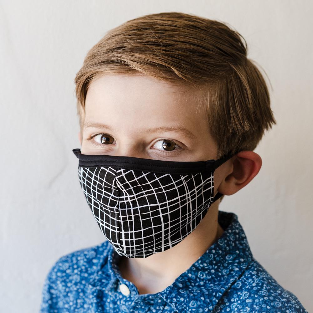 London Children's Face Mask made from 100% cotton, featuring fun designs and elastic straps for a secure fit.