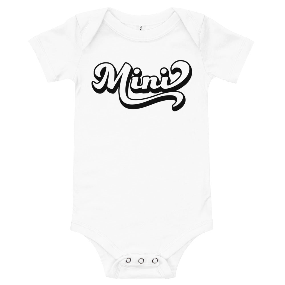 A cute Mini Onesie for babies, made from soft cotton, featuring an envelope neckline and three-snap leg closure, perfect for family photos.