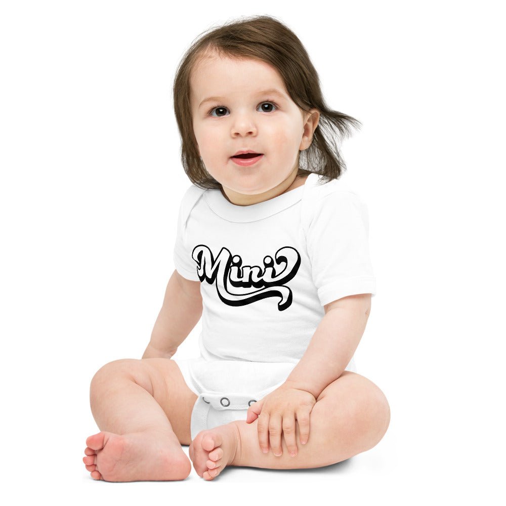 A cute Mini Onesie for babies, made from soft cotton, featuring an envelope neckline and three-snap leg closure, perfect for family photos.