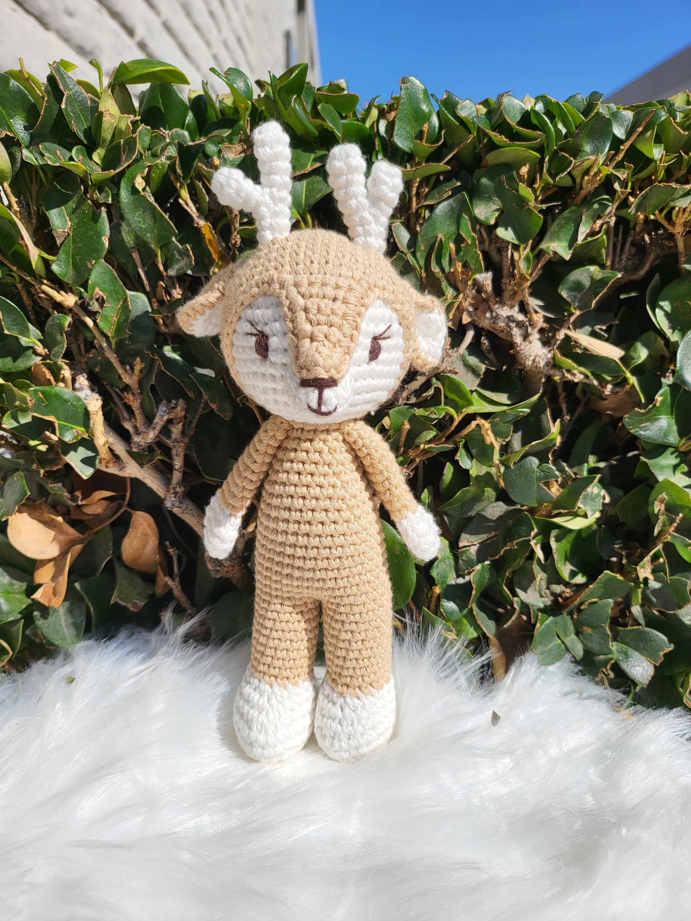 A charming Mini Standing Deer crochet toy made from 100% cotton yarn, featuring a unique design with soft textures and a friendly expression.