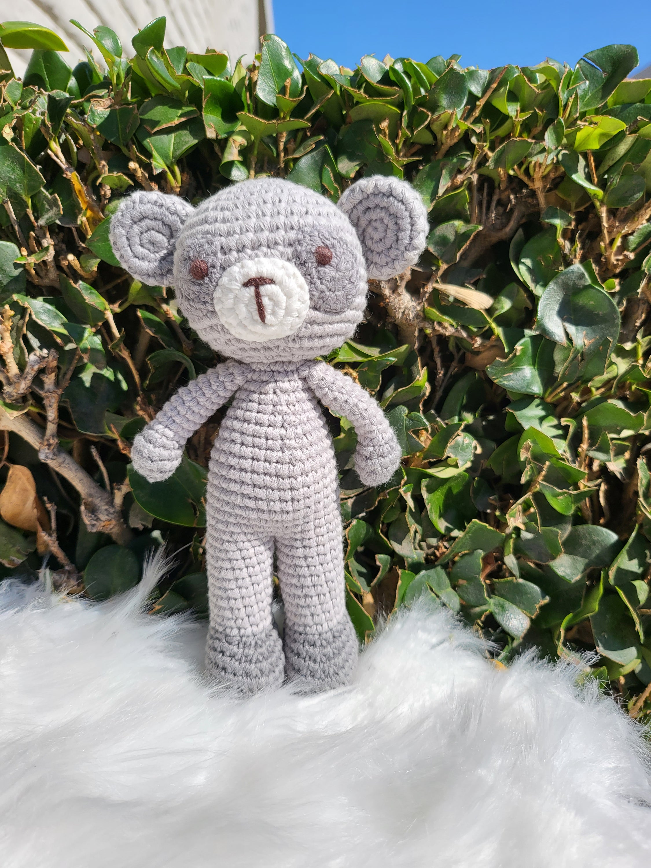 A charming Mini Standing Lemur crochet toy made from 100% cotton yarn, showcasing its unique handmade design and soft texture.