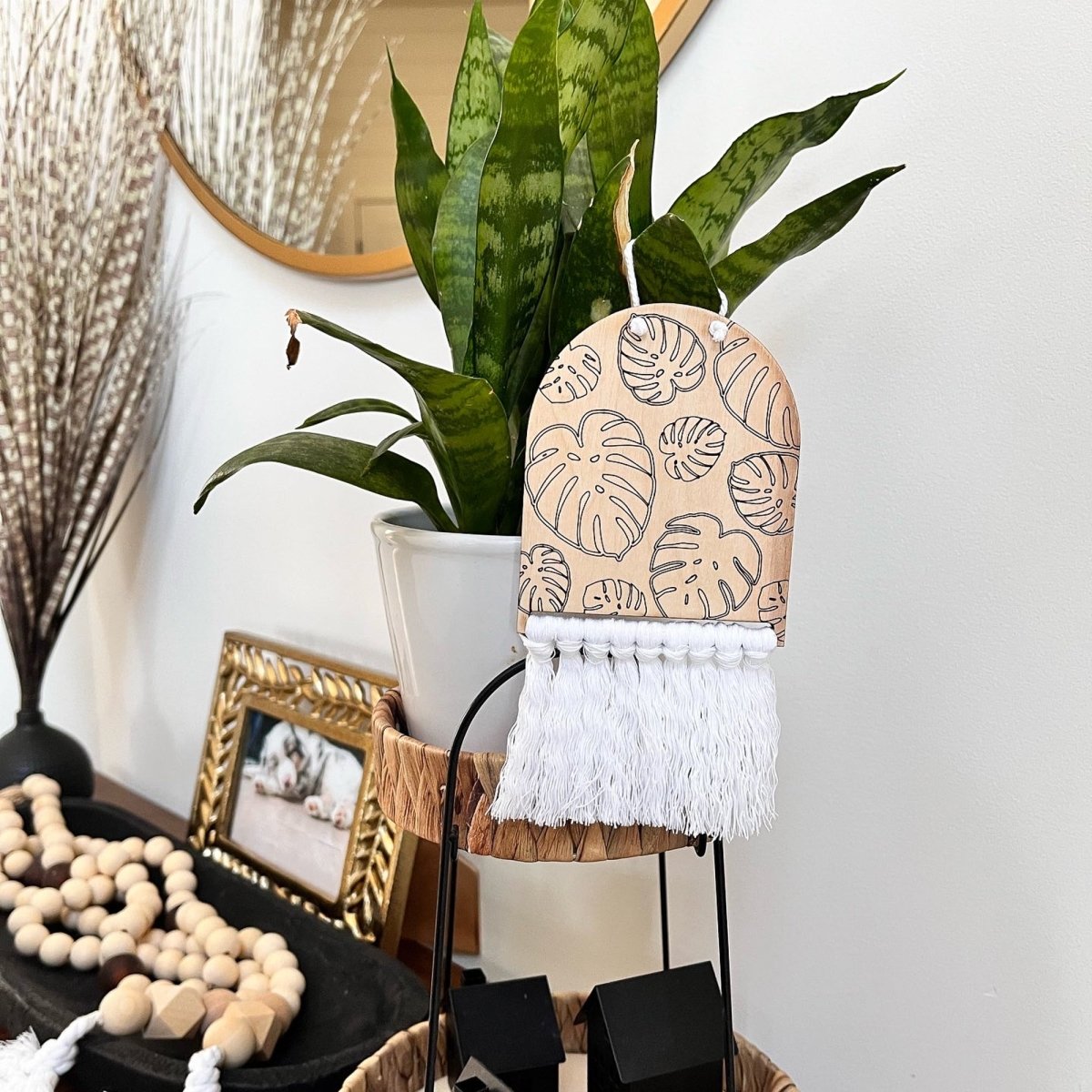 Monstera Leaves Mini Arc Macrame Hanger showcasing intricate laser-cut lettering and elegant macrame design.