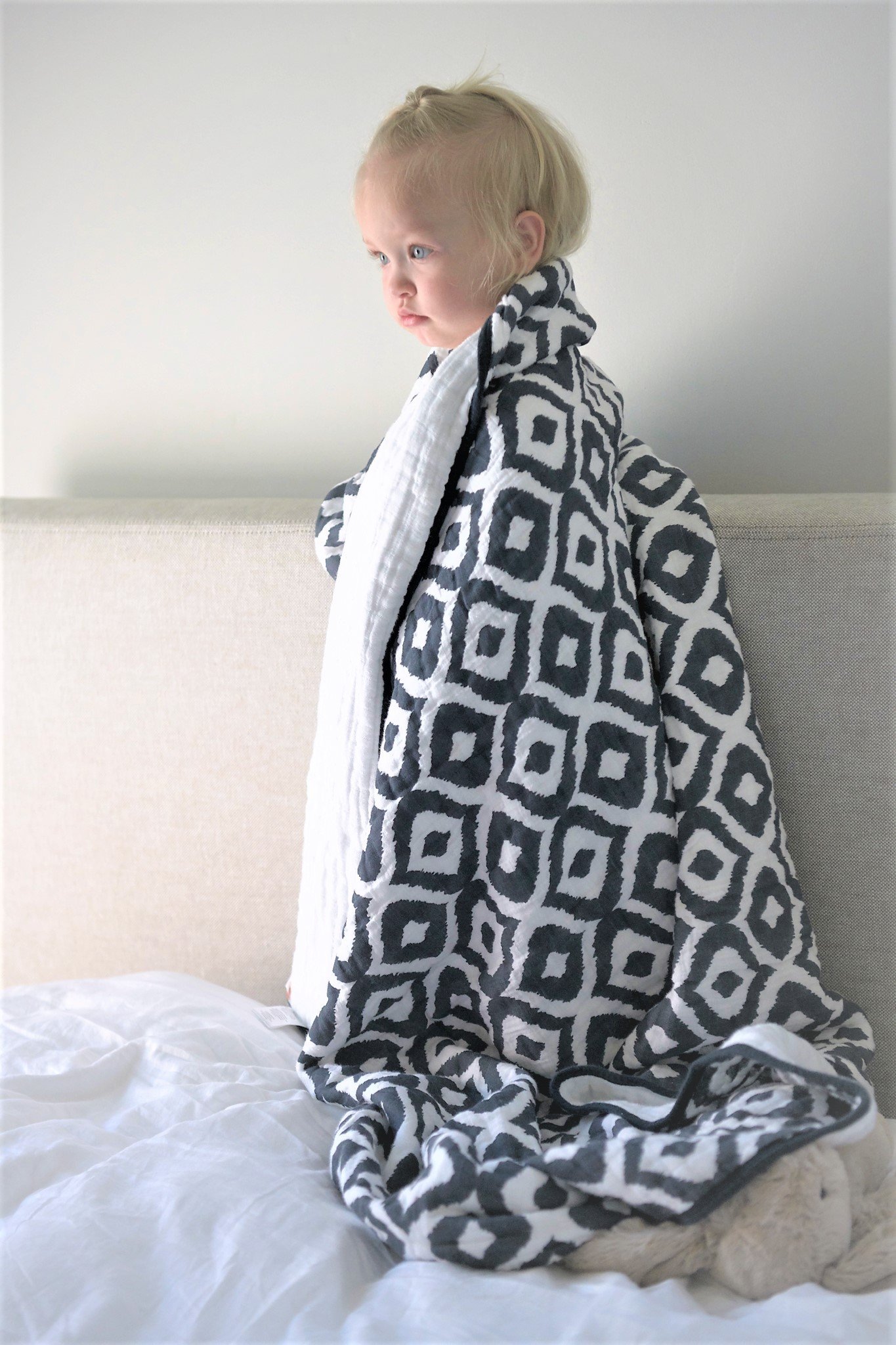 Moroccan Blue Cotton Muslin Newcastle Blanket, showcasing its soft, breathable fabric and stylish design, perfect for kids.