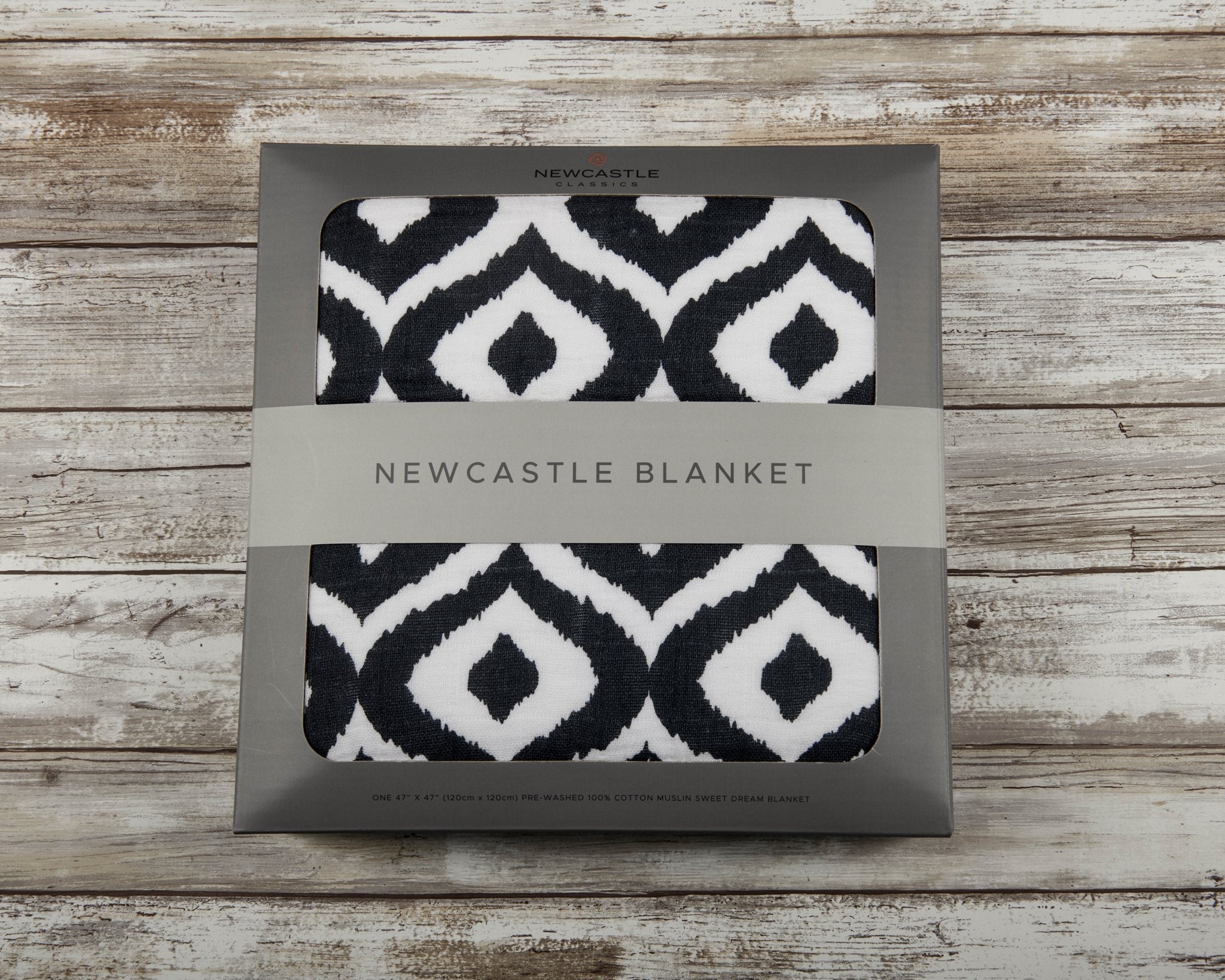 Moroccan Blue Cotton Muslin Newcastle Blanket, showcasing its soft, breathable fabric and stylish design, perfect for kids.