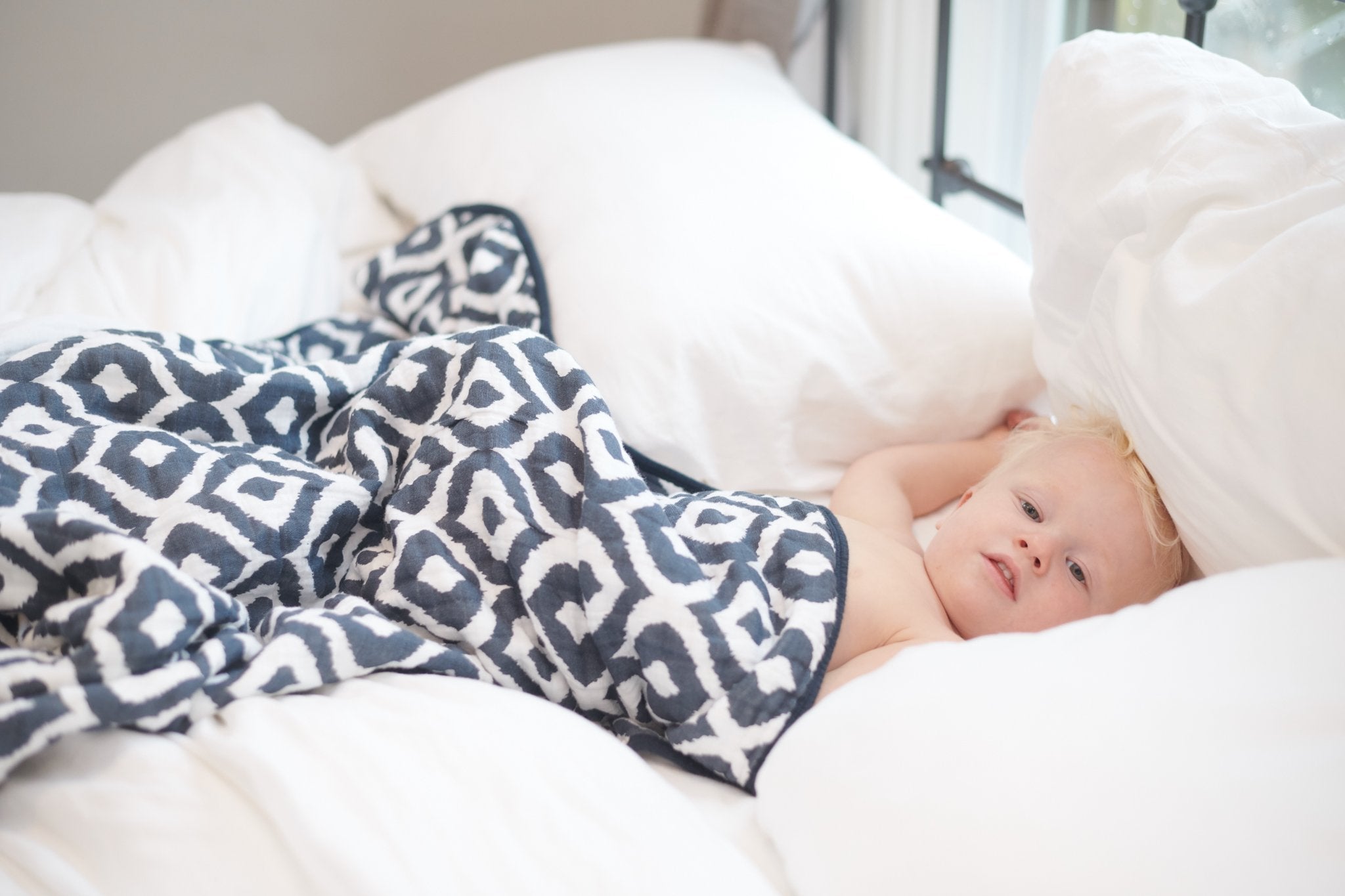 Moroccan Blue Cotton Muslin Newcastle Blanket, showcasing its soft, breathable fabric and stylish design, perfect for kids.