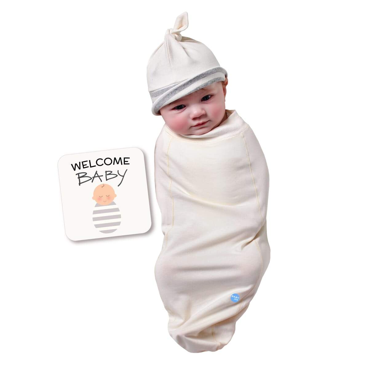 Natural Baby cocoon swaddle set including swaddle, headpiece, and announcement card, designed for newborn comfort.