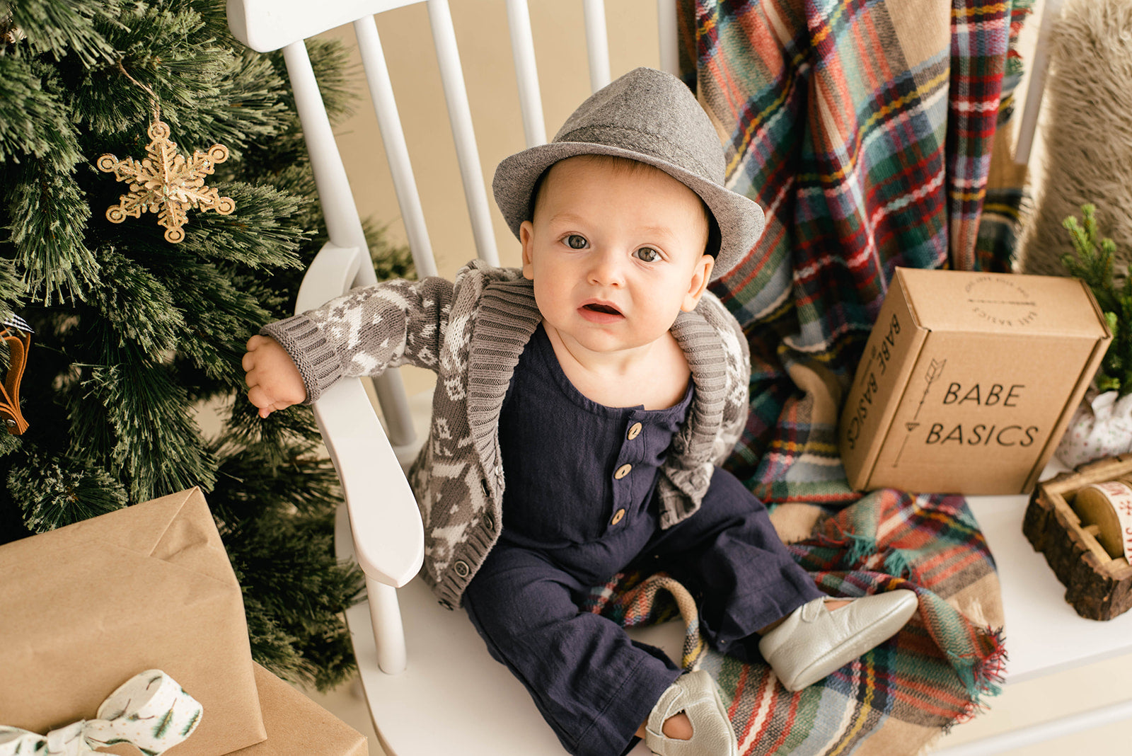 A stylish navy linen romper for babies, featuring diaper snaps and a comfortable fit, perfect for various occasions.