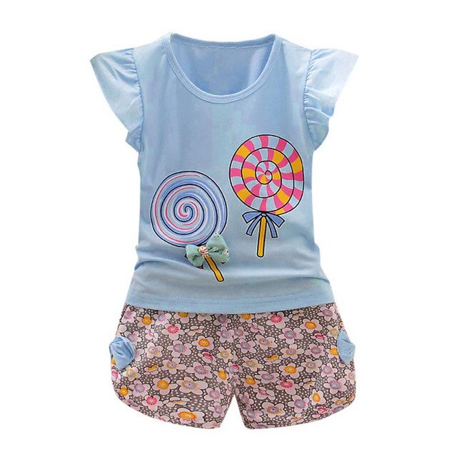 Blue lollipop shirt with floral shorts.