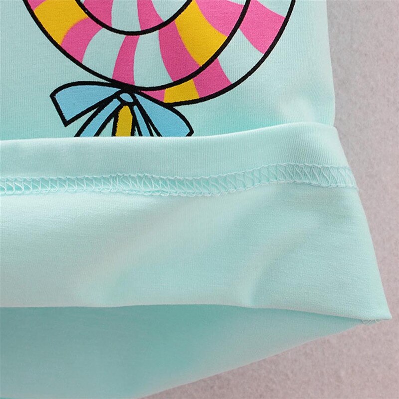 Cartoonish lollipop on mint fabric.