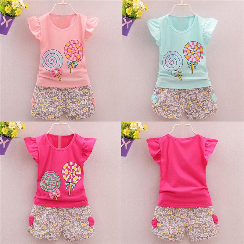 Colorful kids' outfits with lollipop prints.