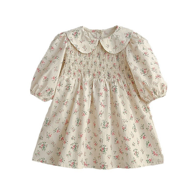 A pink floral print baby onesie with a Peter Pan collar, perfect for autumn wear, showcasing its soft fabric and charming design.