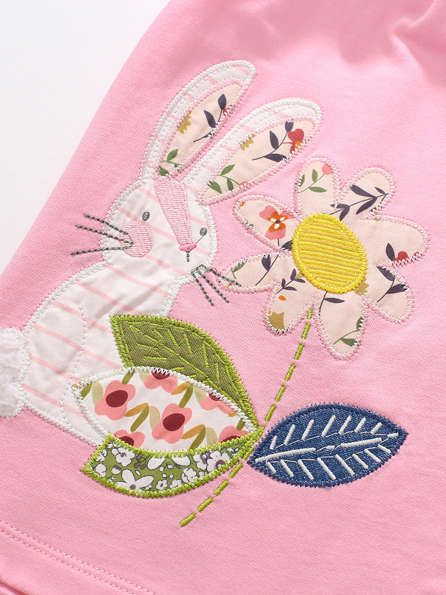 A pink long sleeve crew for girls featuring floral and rabbit patterns, made from soft cotton, perfect for autumn and spring wear.