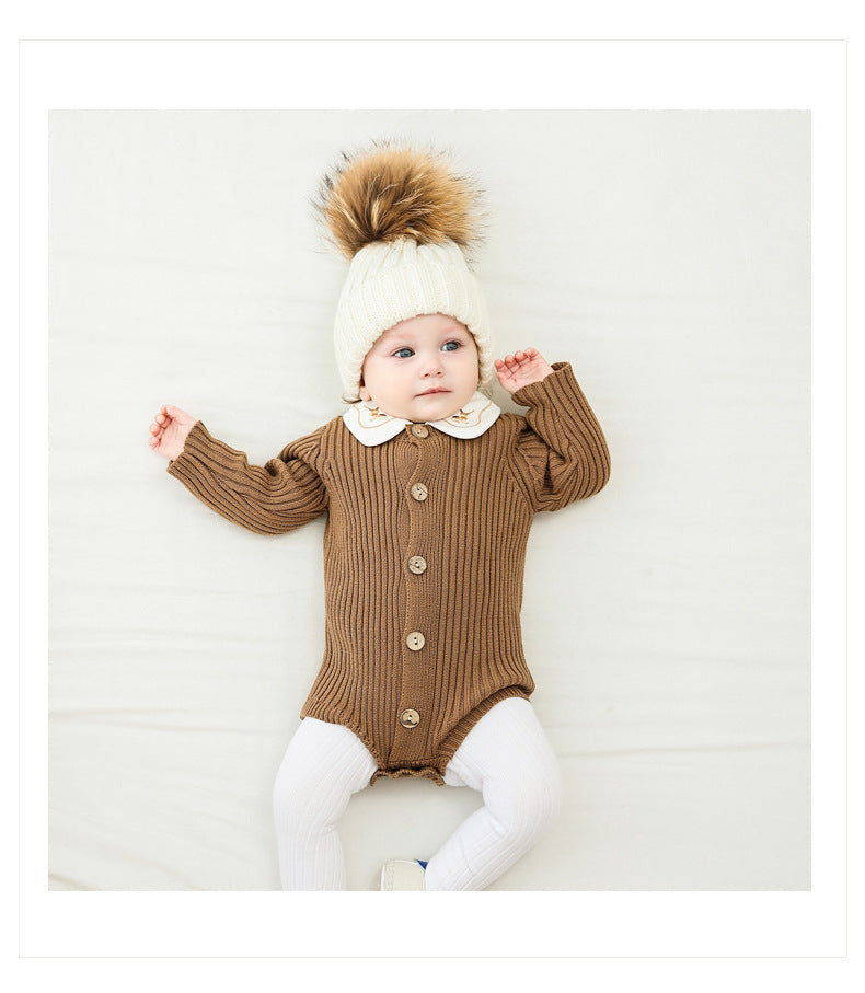 A cozy baby onesie made of soft cotton, available in white and brown, perfect for infants aged 0-24 months.