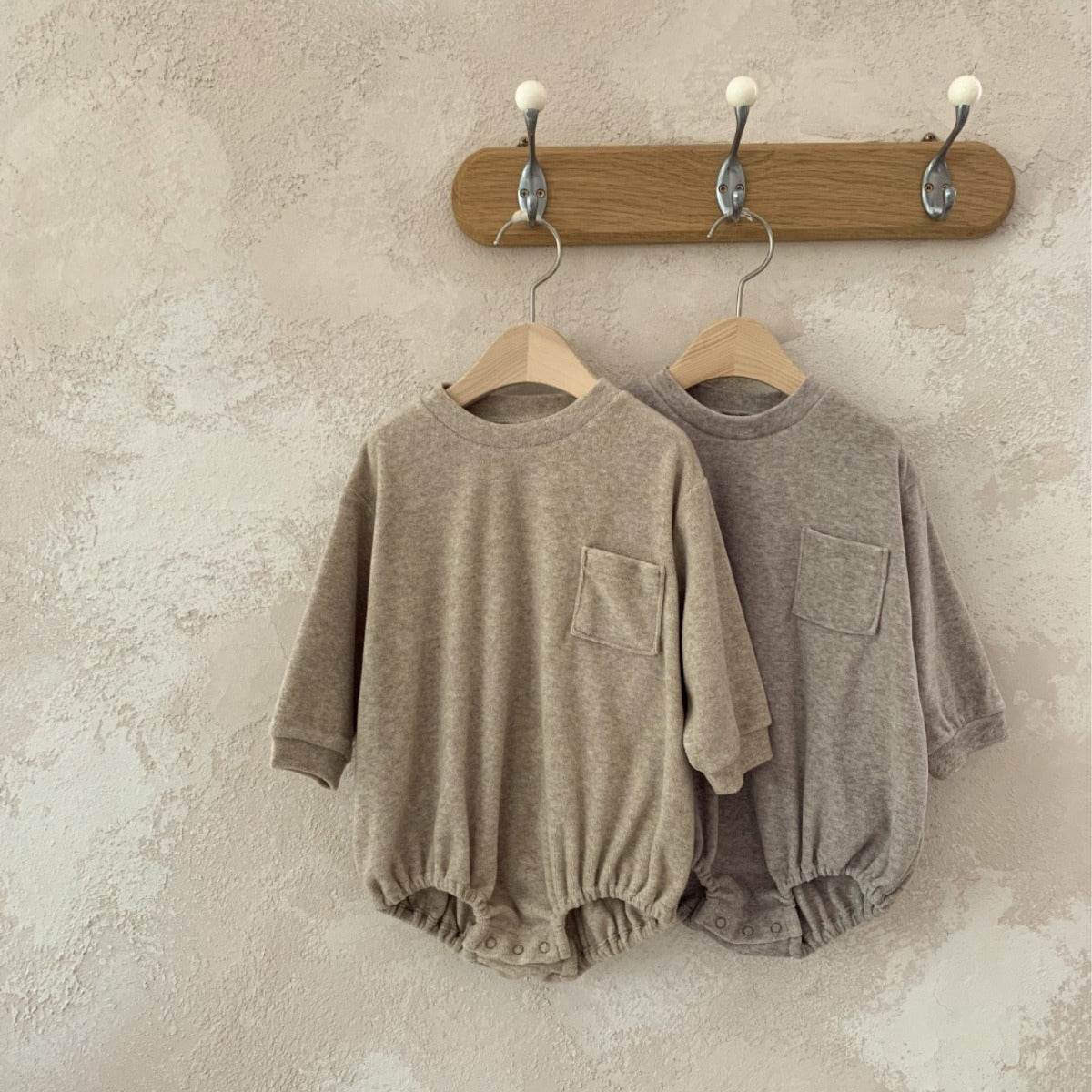 New Arrival Baby Unisex Long Sleeves Onesie in apricot and coffee colors, made from soft viscose fiber, suitable for both genders.