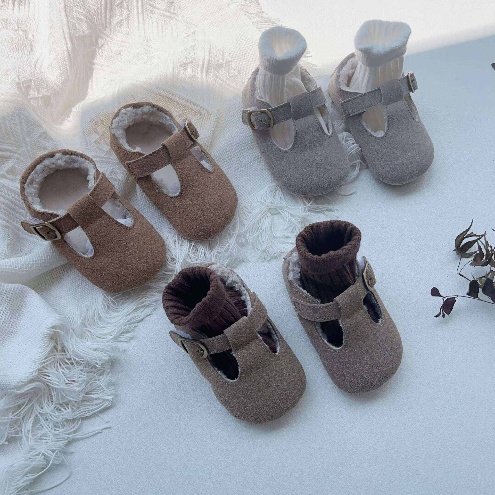 New Arrival Winter Baby Girl Solid Color Plush Warm Anti-Slip Shoes in green, grey, and brown, showcasing their soft material and anti-slip sole.